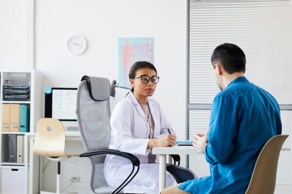 Doctor and patient sitting at office